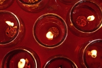 Close up of candles at temple altar - Asia Images Group