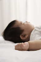 profile of sleeping baby - Asia Images Group