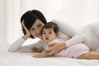 Woman with baby girl - Asia Images Group