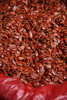 Still life of red melon seeds at market - Asia Images Group