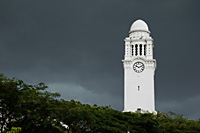 Clock tower against dark skies - Asia Images Group