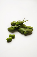 multiple green edamame beans with pea pod broken - Asia Images Group