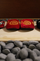 front view of red oriental slippers at door front - Asia Images Group