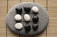 black and white pebbles on zen stone - Asia Images Group