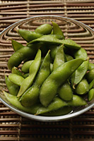 green edamame beans in clear glass bowl - Asia Images Group