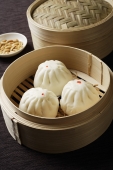 close up of dim sum in bamboo steamer - Asia Images Group