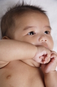 Chinese baby sucking his hand - Asia Images Group