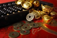 Still life of old Chinese money and abacus. - Asia Images Group