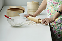 Cropped shot of Chinese woman cooking - Asia Images Group