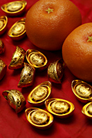 Chinese gold ingot and oranges - Asia Images Group