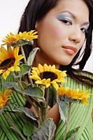 Young woman, with bouquet of flowers, looking at camera - Asia Images Group