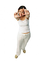 Woman making hand sign, looking at camera - Asia Images Group