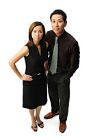 Couple standing, looking at camera, woman with hand on hip - Asia Images Group