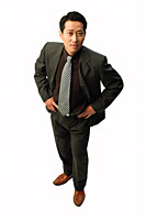 Businessman with hands on hips, looking at camera - Asia Images Group