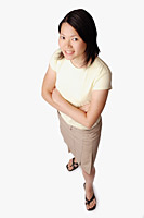 Young woman looking at camera, arms crossed - Asia Images Group