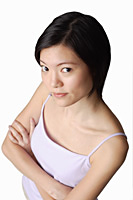 Young woman looking at camera, arms crossed - Asia Images Group