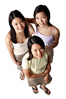 Three young women, looking up at camera - Asia Images Group