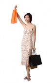Young woman with shopping bags, portrait - Asia Images Group