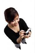 Woman using PDA, high angle view - Asia Images Group
