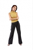 Young woman standing, arms crossed - Asia Images Group