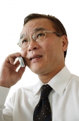 Businessman using mobile phone - Asia Images Group