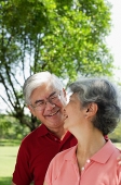 Mature couple, looking at each other, smiling - Asia Images Group