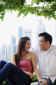 Young couple sitting and looking at each other - Asia Images Group