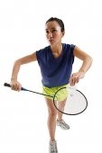 Woman holding badminton racket and shuttlecock - Asia Images Group