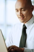 Man using computer - Asia Images Group