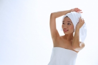 Woman wearing towel on head - Asia Images Group