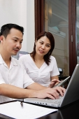 Couple looking at laptop - Asia Images Group
