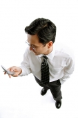 Businessman with mobile phone - Asia Images Group
