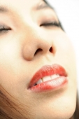 Close up of woman's face, eyes closed - Asia Images Group