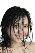 Woman with wet hair, smiling at camera - Asia Images Group