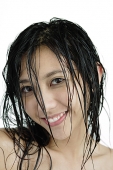 Woman with wet hair, looking at camera, smiling - Asia Images Group