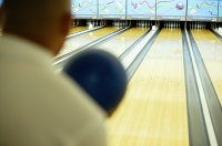 Man bowling - Asia Images Group