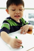 Young boy with crayon, drawing - Asia Images Group