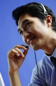 Man wearing headset - Asia Images Group