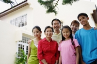Three generation family, standing, looking at camera - Asia Images Group