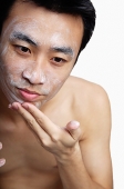 Man cleansing face - Asia Images Group