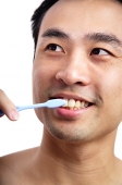 Man brushing teeth - Asia Images Group