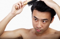 Man with hair brush - Asia Images Group