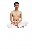 Man sitting in lotus position - Asia Images Group