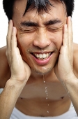 Man washing face - Asia Images Group