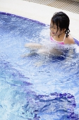 Girl in swimming pool - Asia Images Group
