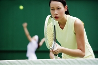 Women playing tennis - Asia Images Group
