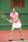 Woman playing tennis - Asia Images Group