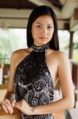 Woman in halter dress, looking at camera - Asia Images Group