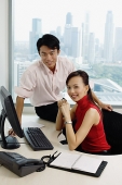 Executives in office looking camera - Asia Images Group