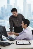Male executives in office, having a discussion, looking at computer - Asia Images Group